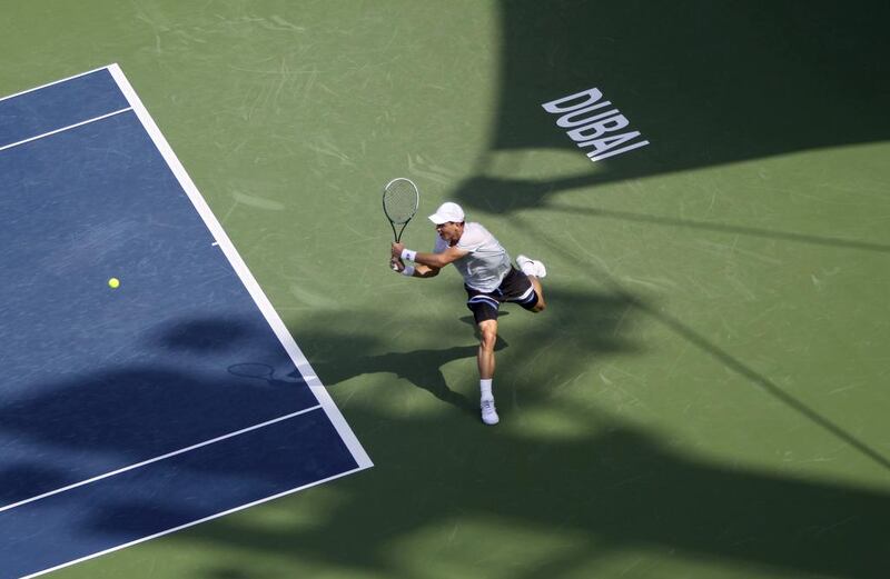 Berdych returns the ball to Marius Copil in the first round, a match he won handily. Kamran Jebreili / AP Photo