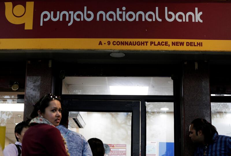People wait in a queue outside a Punjab National Bank ATM in New Delhi, India, February 16, 2018. REUTERS/Saumya Khandelwal
