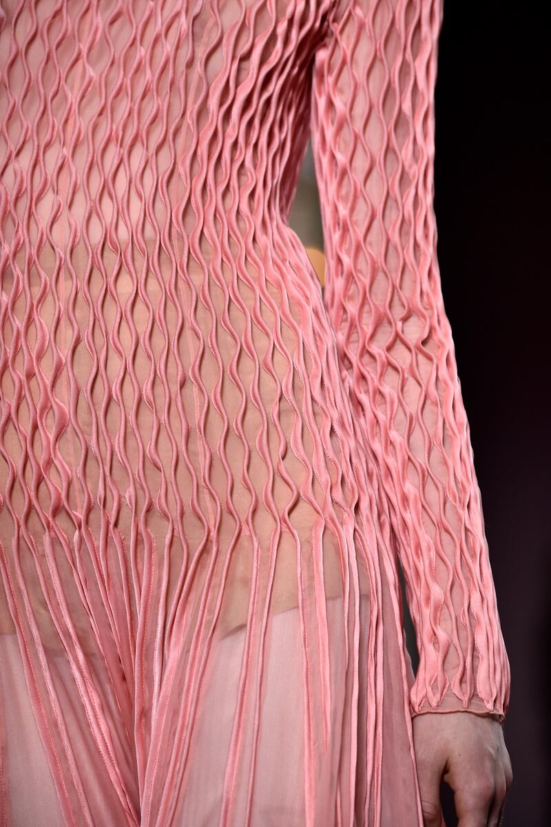 Hand-stitched seams create a ripple effect on a Valentino gown. Photo by Pascal Le Segretain / Getty Images