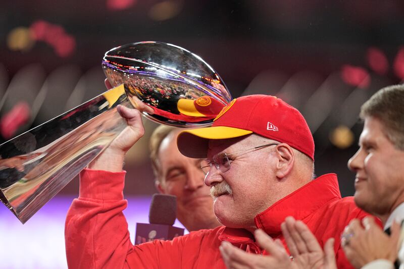 Kansas City Chiefs head coach Andy Reid holds the Vince Lombardi Trophy. AP