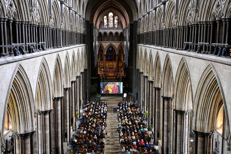 Mourners watch the live stream of the funeral at Salisbury Cathedral. Getty Images
