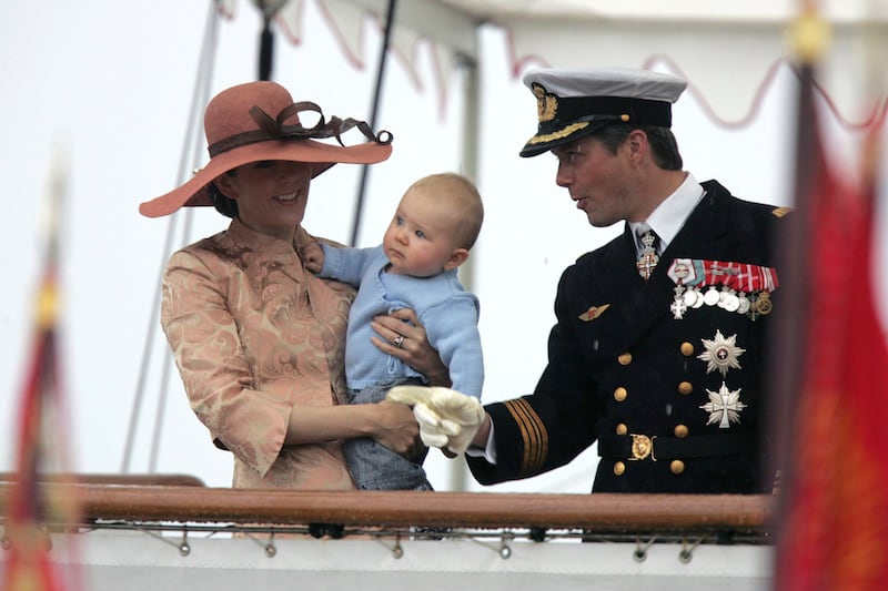 Crown Princess Mary, Crown Prince Frederik and their son, Prince Christian, wave to the crowd at Ronne, Denmark at their arrival on board the royal danish vessel Dannebrog in 2006. AP