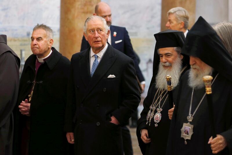 Prince Charles walks with Theophilos III, the Greek Orthodox Patriarch of Jerusalem, during a visit to the Church of the Nativity. AP Photo