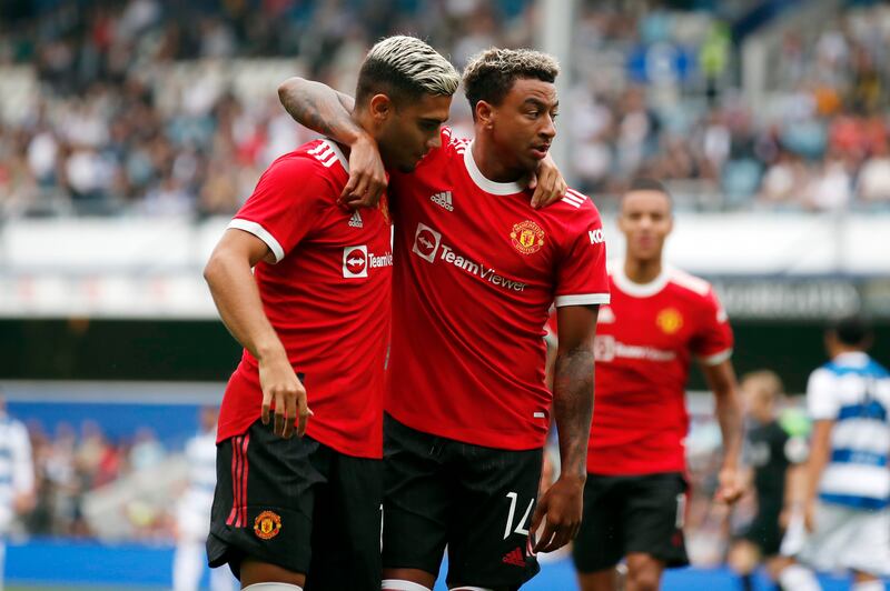 Soccer Football - Pre Season Friendly - Queens Park Rangers v Manchester United - Loftus Road.  London, Britain - July 24, 2021 Manchester United's Jesse Lingard celebrates scoring their first goal with Andreas Pereira Action Images via Reuters / Peter Cziborra