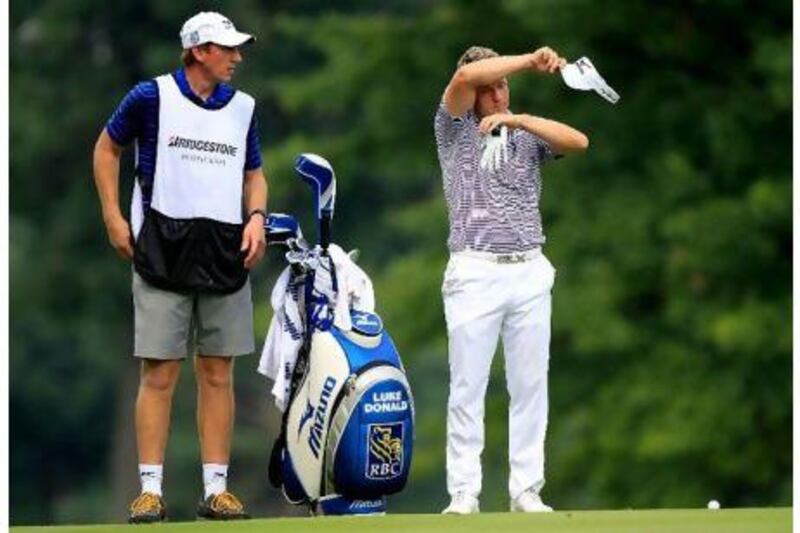 Luke Donald, right, struggled with the weather last week and will come prepared in Atlanta.