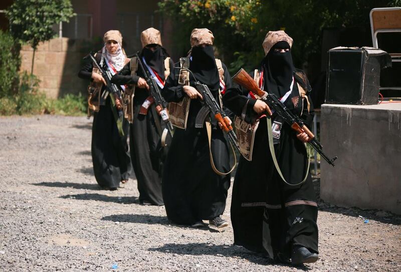 Yemeni female resistance fighters demonstrate their skills in the besieged city of Taez on October 8, 2015. Ahmad Al Basha/AFP Photo