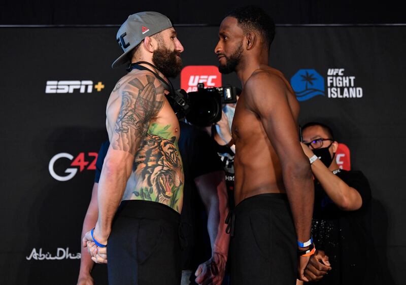 ABU DHABI, UNITED ARAB EMIRATES - JANUARY 19: (L-R) Opponents Michael Chiesa and Neil Magny face off during the UFC weigh-in at Etihad Arena on UFC Fight Island on January 19, 2021 in Abu Dhabi, United Arab Emirates. (Photo by Jeff Bottari/Zuffa LLC) *** Local Caption *** ABU DHABI, UNITED ARAB EMIRATES - JANUARY 19: (L-R) Opponents Michael Chiesa and Neil Magny face off during the UFC weigh-in at Etihad Arena on UFC Fight Island on January 19, 2021 in Abu Dhabi, United Arab Emirates. (Photo by Jeff Bottari/Zuffa LLC)