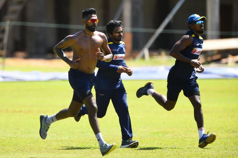 Sri Lankan cricketers Isuru Udana, left, Kusal Perera and Vishwa Fernando run during a practice session. AFP