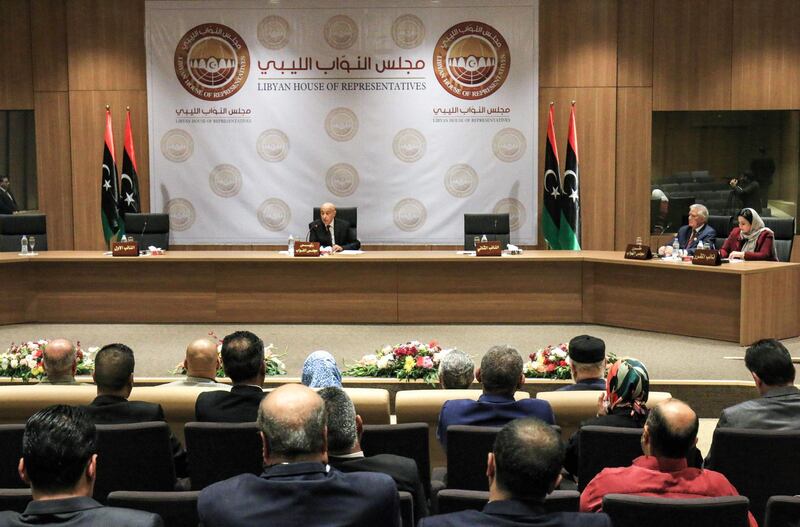 Aguila Saleh Issa (C), speaker of Libya's fomerly-Tobruk-based House of Representatives which was elected in 2014, chairs the first session for the assembly at its new headquarters in the second city of Benghazi in the eastern part of the country controlled by strongman Khalifa Haftar, on April 13, 2019.  / AFP / Abdullah DOMA
