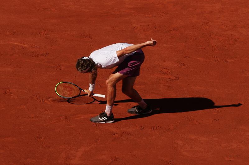 Stefanos Tsitsipas throws his racquet in frustration during the French Open final. Getty Images