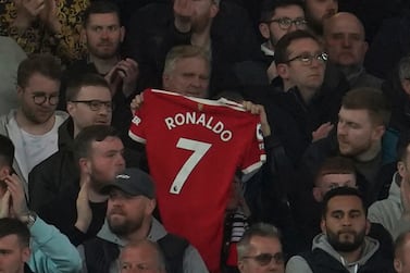 Liverpool fans applaud on the seventh minute in support for Manchester United's Cristiano Ronaldo and his family during the English Premier League soccer match between Liverpool and Manchester United at Anfield stadium in Liverpool, England, Tuesday, April 19, 2022.  (AP Photo / Jon Super)