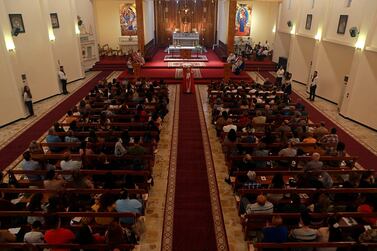 Iraqi Christians attend the Palm Sunday service at Mar Youssif Church in Baghdad, Iraq, Sunday, April 14, 2019. AP