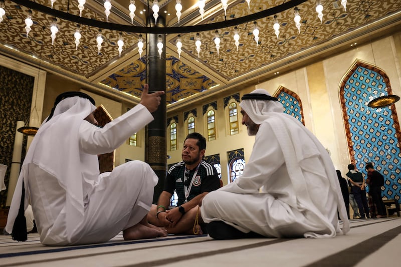 Football fans have been meeting Gulf residents inside Doha's Blue Mosque. Qatar has taken advantage of the World Cup to reach out to the hundreds of thousands of visiting supporters by engaging with them and sharing ideas. AFP
