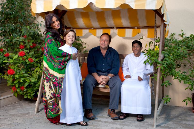 Hala Kazim with her husband Kamel Hamza and children Tariq Abdulla and Hassan Kamel Hamza at their home in Dubai. Clint McLean for The National