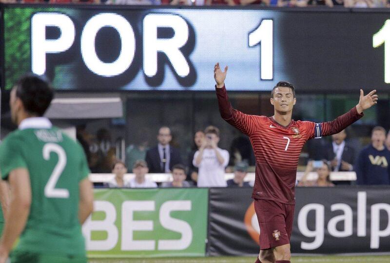 Portugal forward Cristiano Ronaldo reacts after he misses a penalty kick during Tuesday's friendly against Ireland. Ray Stubblebine / Reuters / June 10, 2014