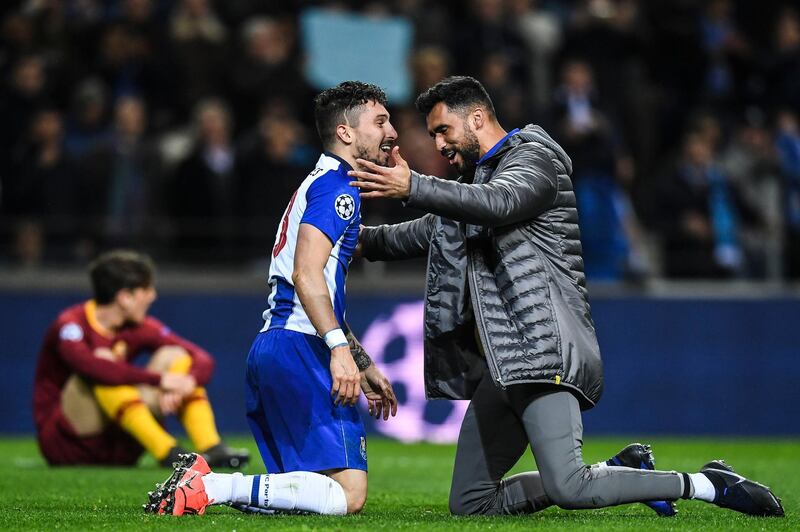 Brazilian defender Alex Telles, left, celebrates Porto's win of their Uefa Champions League last-16 second-leg win over Roma. Patricia de Melo Moreira / AFP