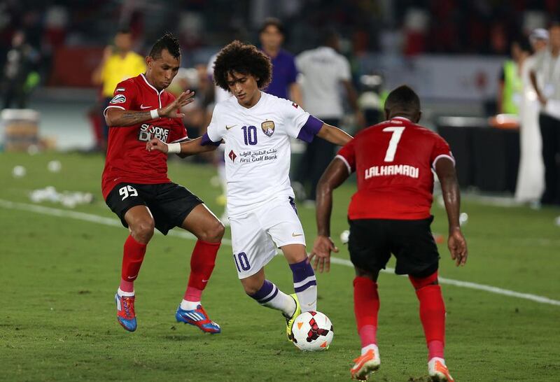 Omar Abdulrahman, centre, continues to say he his happy at Al Ain, but he also still harbours dreams of playing in Europe. Pawan Singh / The National 