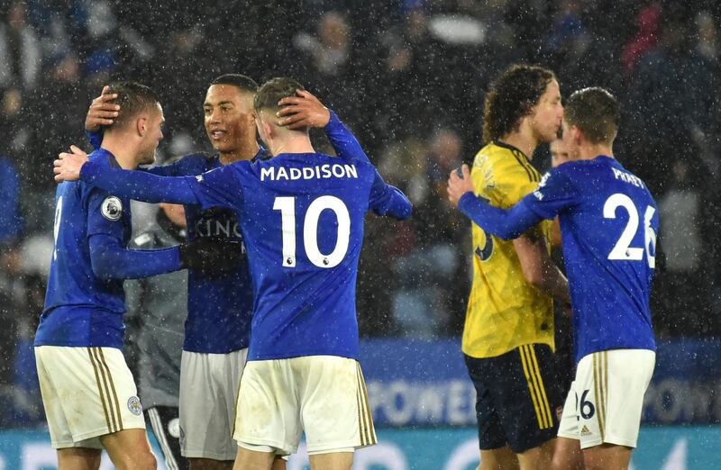 Leicester players celebrate their victory over Arsenal. AP Photo