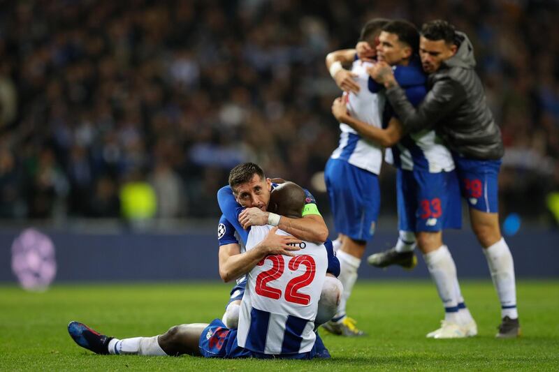 Porto's Hector Herrera, left, celebrates with Danilo Pereira after winning their Uefa Champions League last-16 second-leg match against Roma. Jose Coelho / EPA