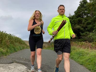 The National’s Nicky Harley and Yorkshire medic Huw Selly run an 11km section of the Cop27 baton relay in Castleton, Derbyshire. The National