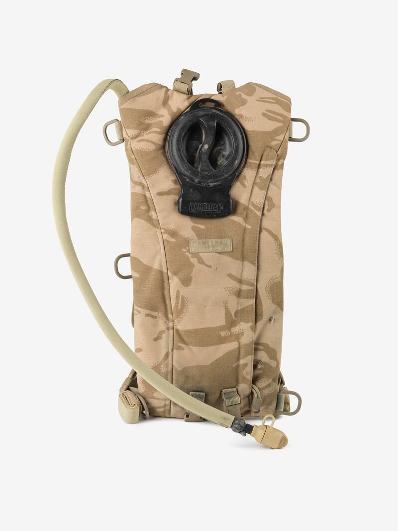 A hydration pack used by a British soldier in Afghanistan in 2010, hit by bullets during a firefight with the Taliban in Helmand province. It is on display at Imperial War Museums North, in Stretford, north England. Photo: Imperial War Museums