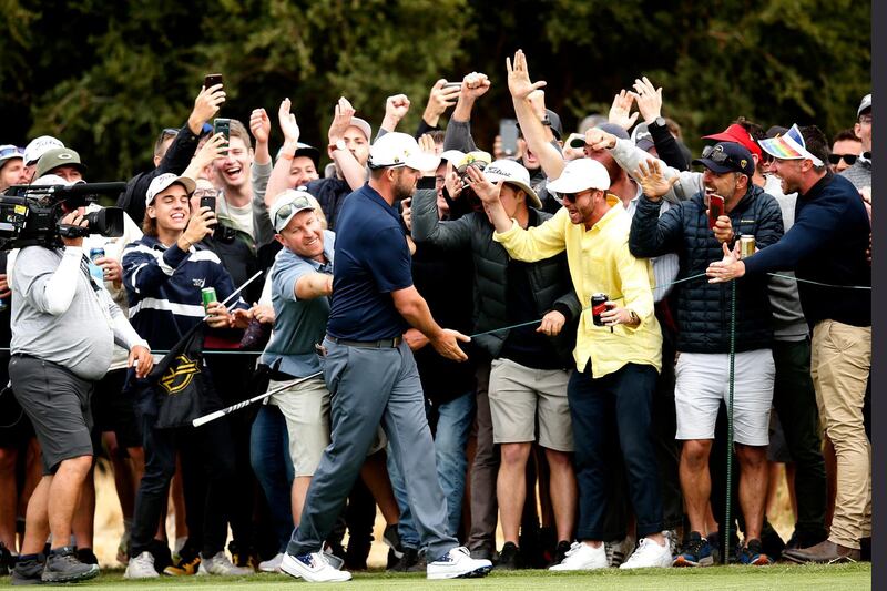 Marc Leishman celebrates with fans. Getty