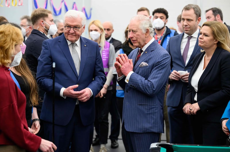 Britain's King Charles III, German President Frank-Walter Steinmeier, left, and German Interior Minister Nancy Faeser, right, visit a centre for Ukrainian refugees in Berlin during the king's visit to Germany. AFP