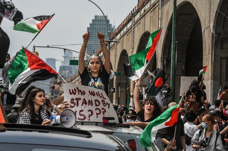 NEW YORK, NY - MAY 22: People participate in a pro-Palestinian rally on May 22, 2021 in the Queens borough of New York City. After the recent ceasefire between Israelis and Palestinians, activists in New York protested for an end to the Israeli occupation of Palestine.   Stephanie Keith/Getty Images/AFP
== FOR NEWSPAPERS, INTERNET, TELCOS & TELEVISION USE ONLY ==
