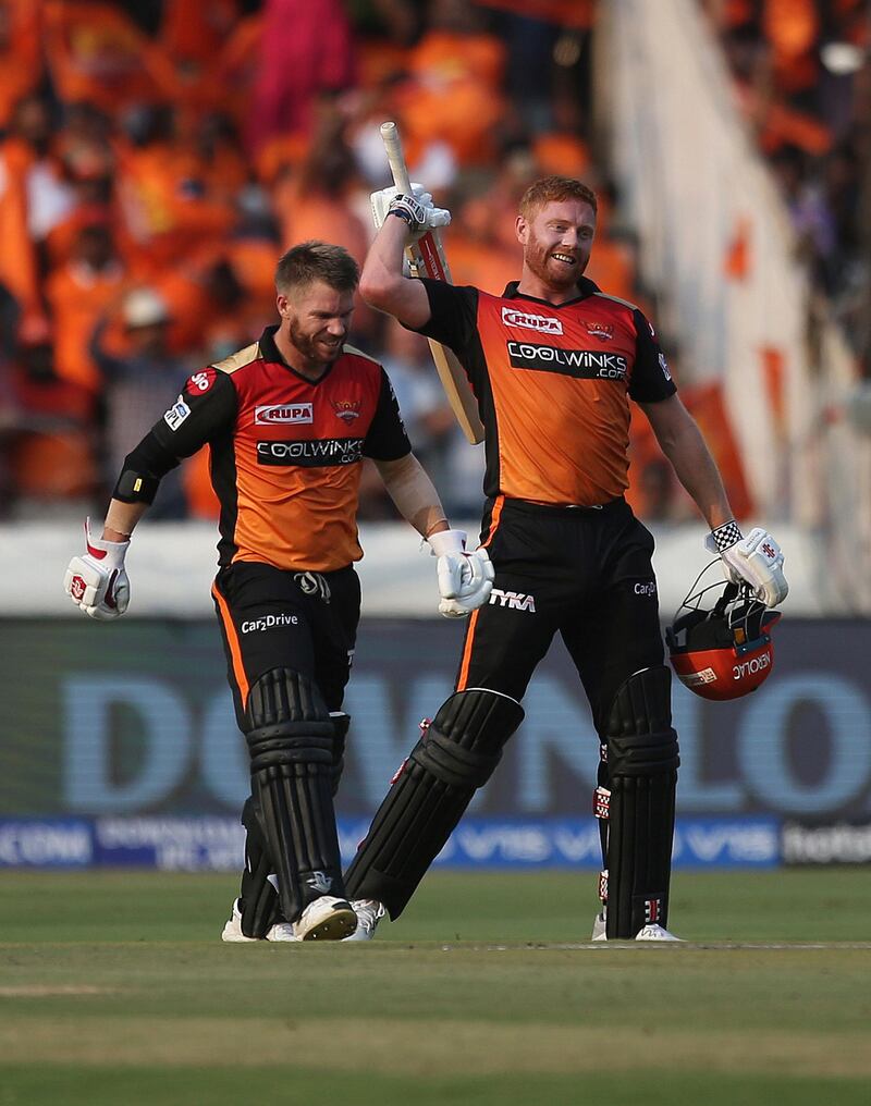 Sunrisers Hyderabad's David Warner, left, greets Jonny Bairstow on scoring hundred runs against Royal Challengers Bangalore during the VIVO IPL T20 cricket match in Hyderabad, India, Sunday, March 31, 2019. (AP Photo/ Mahesh Kumar A.)