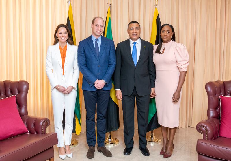 Prince William and Kate pose for a photograph with Mr Holness and his wife. Getty Images
