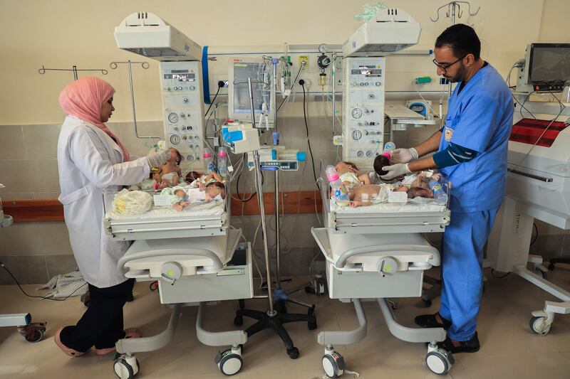 Palestinian medics care for premature babies evacuated from Gaza city's Al Shifa Hospital before their transfer to Egypt. AFP