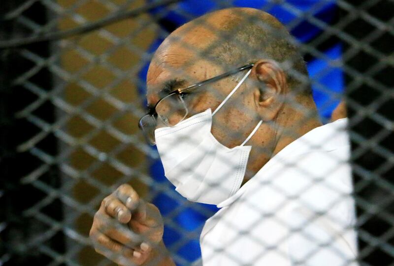 FILE PHOTO: Sudan's ousted President Omar al-Bashir is seen inside the defendant's cage during his and some of his former allies trial over the 1989 military coup that brought the autocrat to power in 1989, at a courthouse in Khartoum, Sudan September 15, 2020. REUTERS/Mohamed Nureldin Abdallah/File Photo