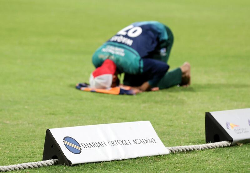 Players pray before the Sharjah Ramadan Cup game between MGM Cricket Club v Pacific Group in Sharjah on April 27th, 2021. Chris Whiteoak / The National. 
Reporter: Paul Radley for Sport