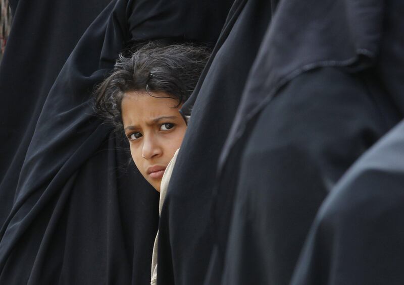 epa06145948 A young Yemeni girl waits amongst the crush of women lining up to receive free bread at a charity bakery during a severe shortage of food in Sana'a, Yemen, 15 August 2017. According to reports, nearly 20.7 million people of Yemen's 26-million population are in need of humanitarian assistance as a result of increased food insecurity. The impoverished Arab country is experiencing a humanitarian crisis due to an ongoing brutal conflict that has lasted more than two years.  EPA/YAHYA ARHAB