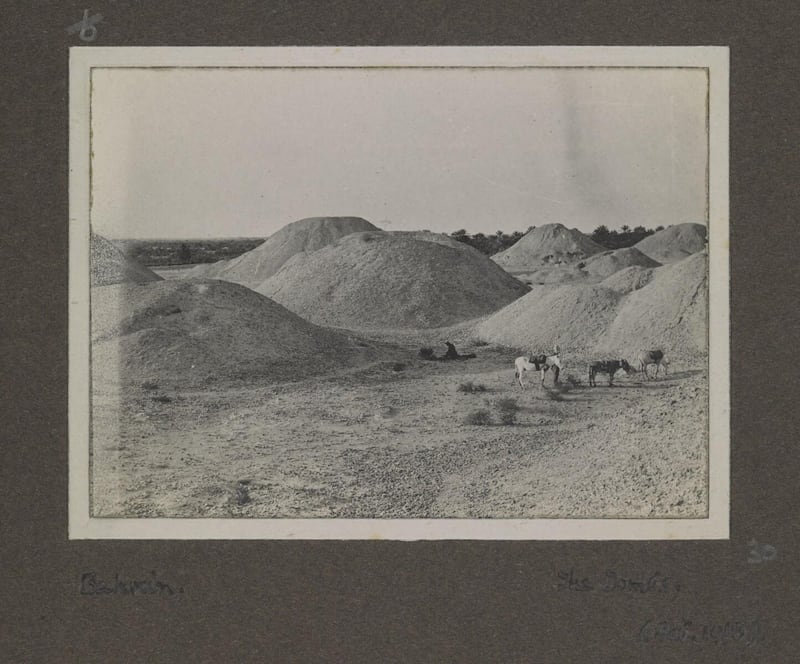 The view in 1918 with donkeys in front of some of the thousands of Bronze Age tombs on Bahrain , once the heart of the Dilmun trading empire. British Library