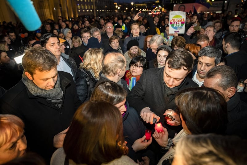 Personalities from politics and society gather for a vigil at the Brandenburg Gate to commemorate the victims of the Hanau shootings in Berlin, Germany. A local man named Tobias Rathjen is the main suspect in having shot dead nine people last night at two hookah bars in Hanau, and possible his mother and himself later on when police prepared to raid his apartment. Police suspect a right-wing motive to the attacks. Getty Images