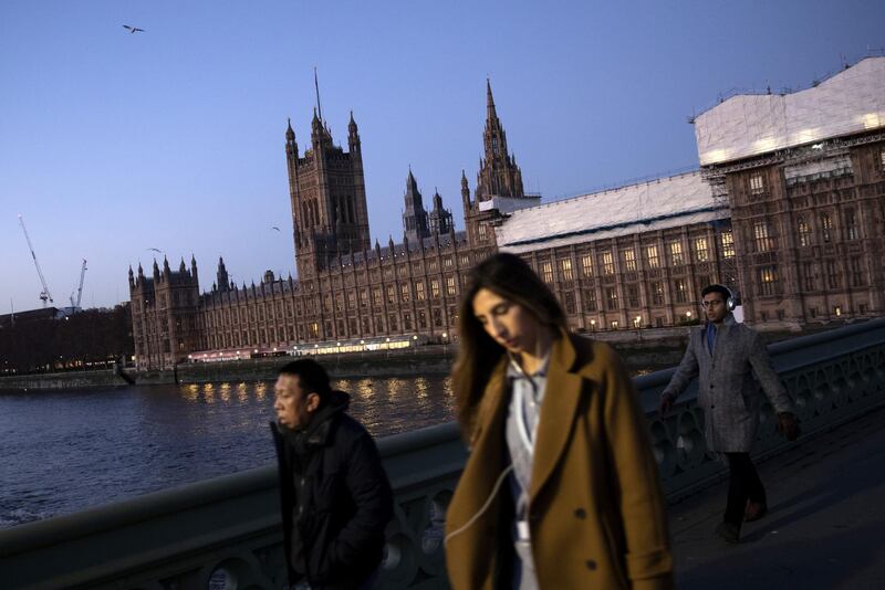 LONDON, ENGLAND - DECEMBER 04: Members walk over Westminster Bridge near the Houses of Parliament at first light on December 4, 2018 in London, England. The Prime Minister Theresa May will begin five days of debate today in the commons where she will try to sell her Brexit Deal to MPs. Members of Parliament will vote on the Brexit deal on December 11, 2018. (Photo by Dan Kitwood/Getty Images)