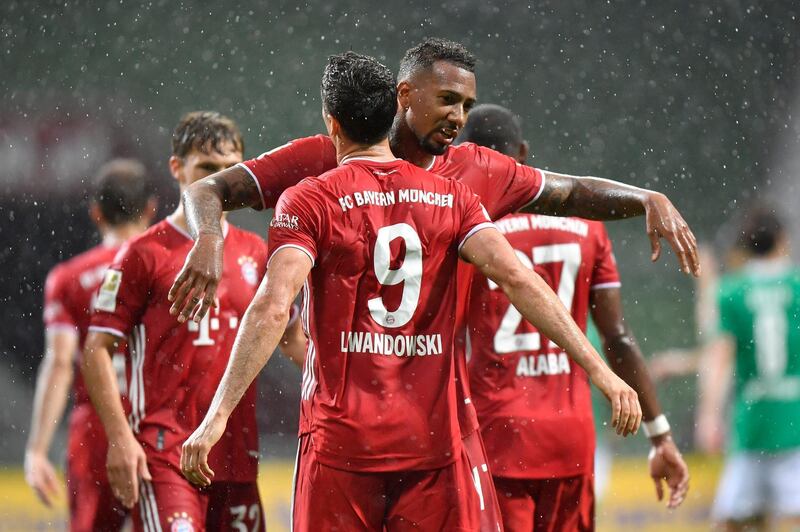 Bayern's No9 Robert Lewandowski celebrates with his Jerome Boateng after scoring his side's only goal against Werder Bremen. AP