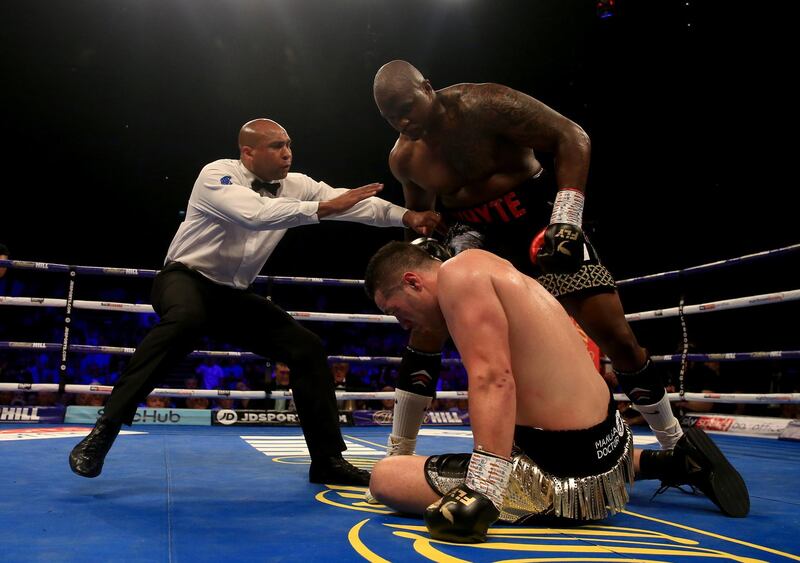 The referee steps in after Dillian Whyte is adjudged to have knocked Joseph Parker down. Getty Images
