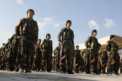 (FILES) In this file photo taken on November 10, 2018, fighters from the Syrian Democratic Forces (SDF), participate in a military parade during the funeral of a fellow fighter, killed during a military mission, in the Kurdish-controlled city of Qamishly in northeastern Syria. Any unilateral military action in northern Syria would be "unacceptable," the Pentagon warned Wednesday after Turkey said it would soon launch an operation against a US-backed Kurdish militia. "Unilateral military action into northeast Syria by any party, particularly as US personnel may be present or in the vicinity, is of grave concern," Pentagon spokesman Commander Sean Robertson said in a statement. / AFP / Delil SOULEIMAN
