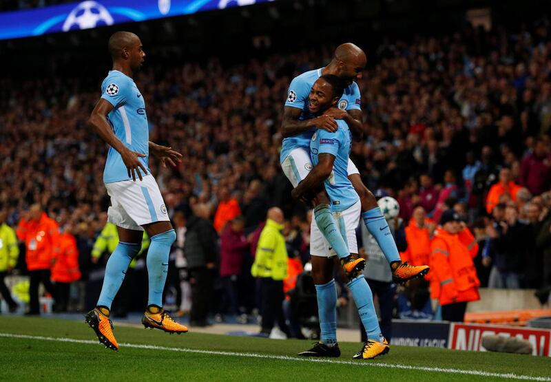 Manchester City's Raheem Sterling celebrates with Fabian Delph and Fernandinho after scoring Manchester City's second goal. Phil Noble / Reuters