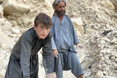  Mohammad Naeem, 45, with his son Faizmad, 16, break rocks at a quarry in northern province of Samangan in Afghanistan. Hikmat Noori for The National