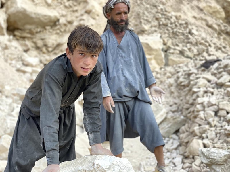 Mohammad Naeem, 45, and his son Faizmad, 16, work together at a mine in the northern Afghan province of Samangan. Hikmat Noori for The National