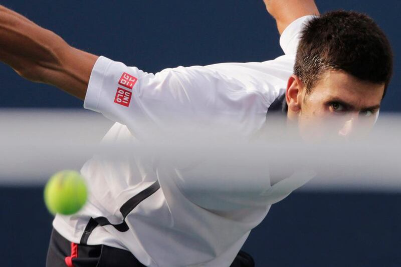 Serbia' Novak Djokovic returns a shot to Spain's David Ferrer during a semifinal match at the 2012 US Open tennis tournament,  Saturday, Sept. 8, 2012, in New York. (AP Photo/Charles Krupa)