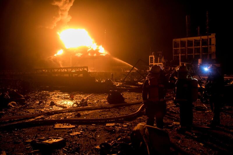 Firefighters work on extinguishing the fire following the explosion. Reuters