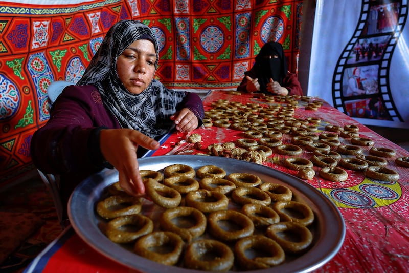 Palestinian women make traditional cakes in Rafah, the southern Gaza Strip. Reuters
