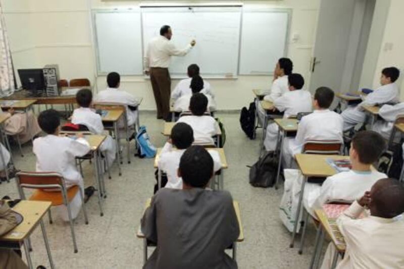 United Arab Emmirates - Abu Dhabi - Sep 24 - 2008 : A teacher during a class for children at Mohamed bin Khaled School. ( Jaime Puebla / The National ) *** Local Caption ***  JP 112 - MOHAMED BIN KHALED SCHOOL.jpgJP 112 - MOHAMED BIN KHALED SCHOOL.jpg