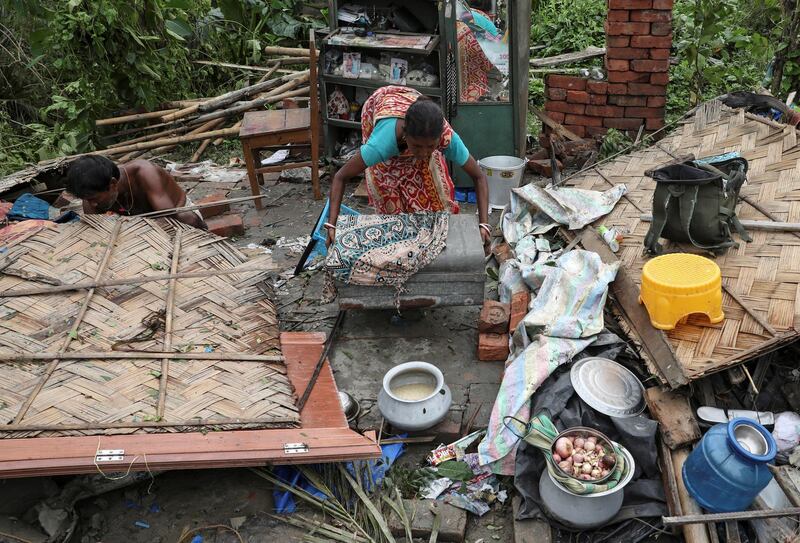 Residents salvage their belongings from the rubble of a damaged house in the aftermath of Cyclone Amphan, in South 24 Parganas district in the eastern state of West Bengal, India. REUTERS