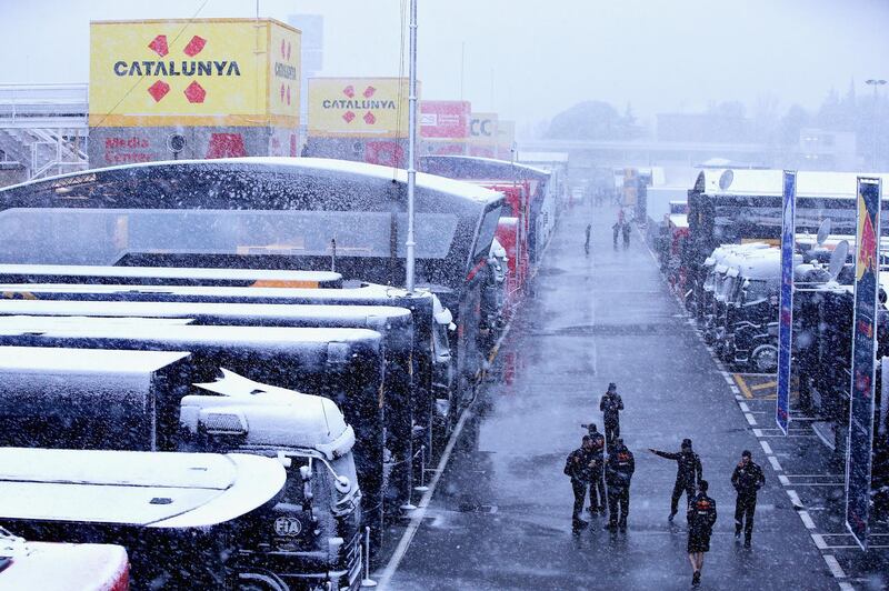 The Red Bull Racing team arrive at the circuit in snowy conditions during day three of F1 Winter Testing at Circuit de Catalunya. Charles Coates/Getty Images