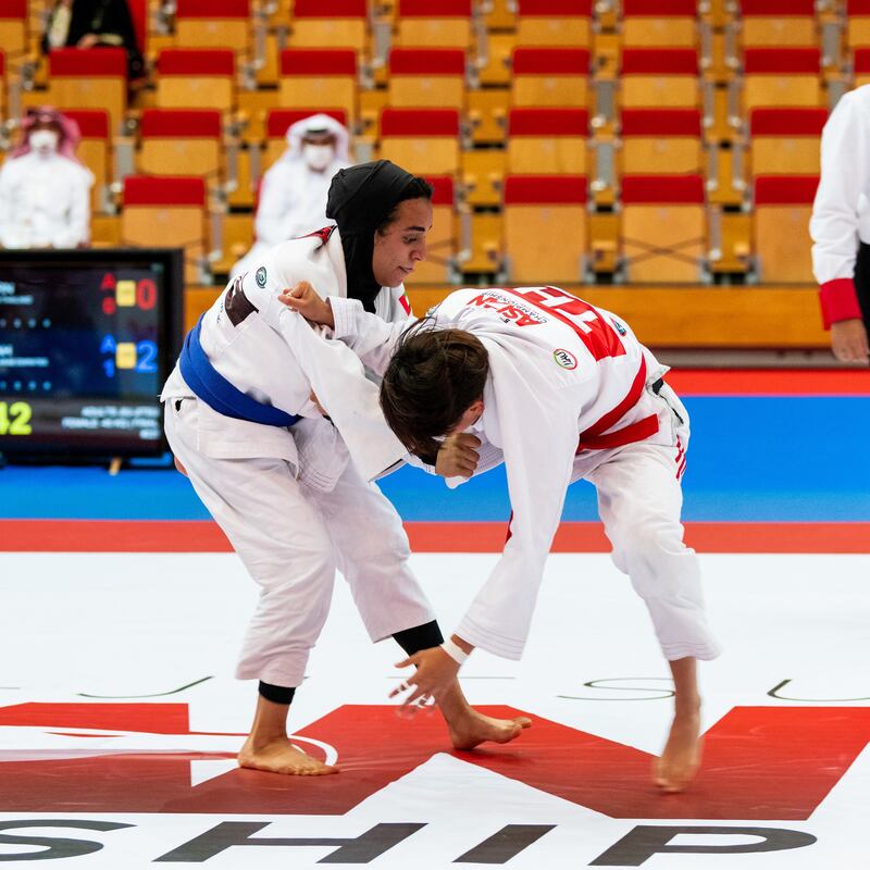 Hamdah Al Shikeili, left, defeated Thai Tadaporn Sakaew at the Jiu-Jitsu Asian Championships in Abu Dhabi. Courtesy UAEJJF